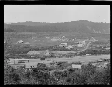 Image: The settlement of Kakahi with railway station and sawmill in foreground and local houses and forest covered hills beyond, Manawatu-Whanganui Region