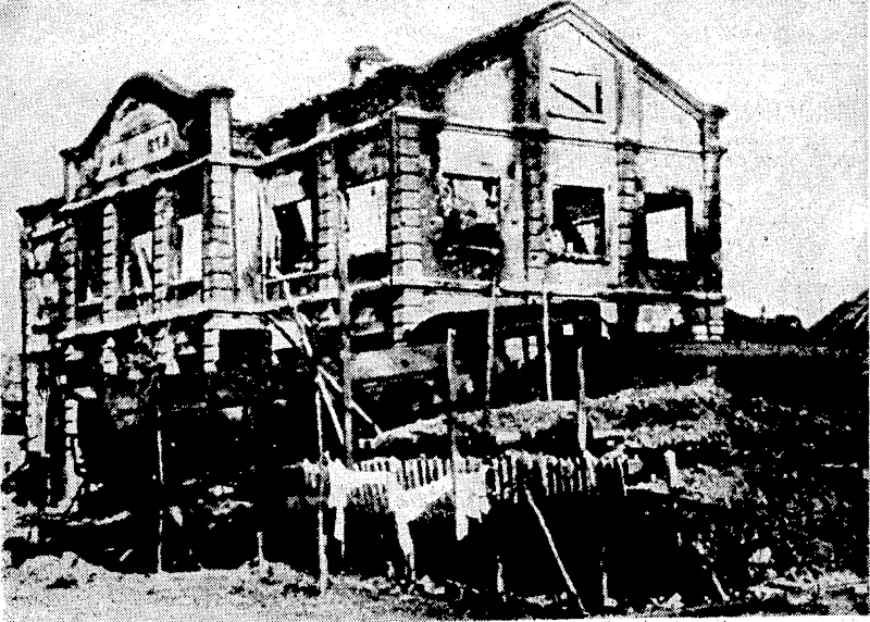 Wide World Photo. The burned shell of the.railway station at Wuhu, which ivas in the Japanese line,of attach on Nanking, the Chinese capital. The locomotive in the- foreground: ivasfblown from its tracks by a Japanese air bomb and landed in the position seen in the picture. (Evening Post, 26 January 1938)