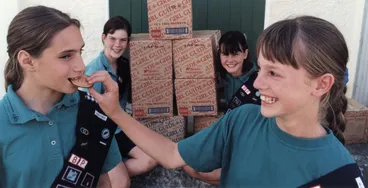 Image: Girl Guides; fund-raising; alternative chocolate biscuits introduced.
