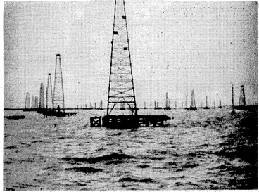 Image: A view >of the; oil \gantries)at Lake Maracaiboy A cablegram 'published ; yesterday reported; a great, fire at -the /oil port,.'.. spreading over- the lake, andrdoing xmuck ; – 'damage. : ;:-/ > j ■. .;... "Evening. Post'1 ~Photo. • 'M. A. Pouquet (centre) for-France, -opened the Hutt Horticultural Society's rose show at Lower Hutt yesterday afternoon. 1 He is seen discussing the blooms with the Hon. 3W. Nash 'v(right),, • ■■-■• – Minister of'Finance. " ■ (Evening Post, 16 November 1939)