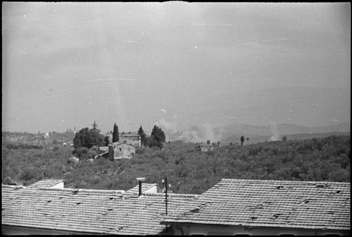 Photograph taken from San Casciano showing shells and bombs bursting on German tank positions on main road to Florence, Italy, World War II - Photograph by George Kaye