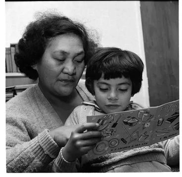 Image: Helping daughter with reading; Knucklebones, Orakei Marae, Auckland