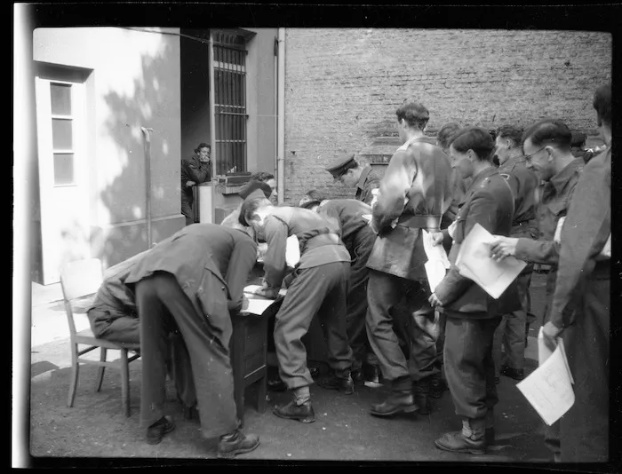 Ex-prisoners of war fill in identity forms - Photograph taken by Lee Hill