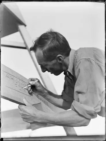 Image: Bert Jones carving his name in the trig, Whatipū