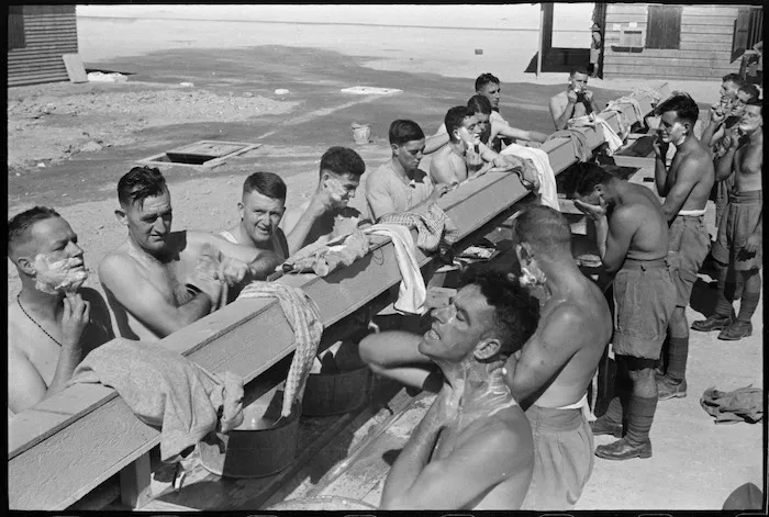 Soldiers washing and shaving outdoors, Egypt