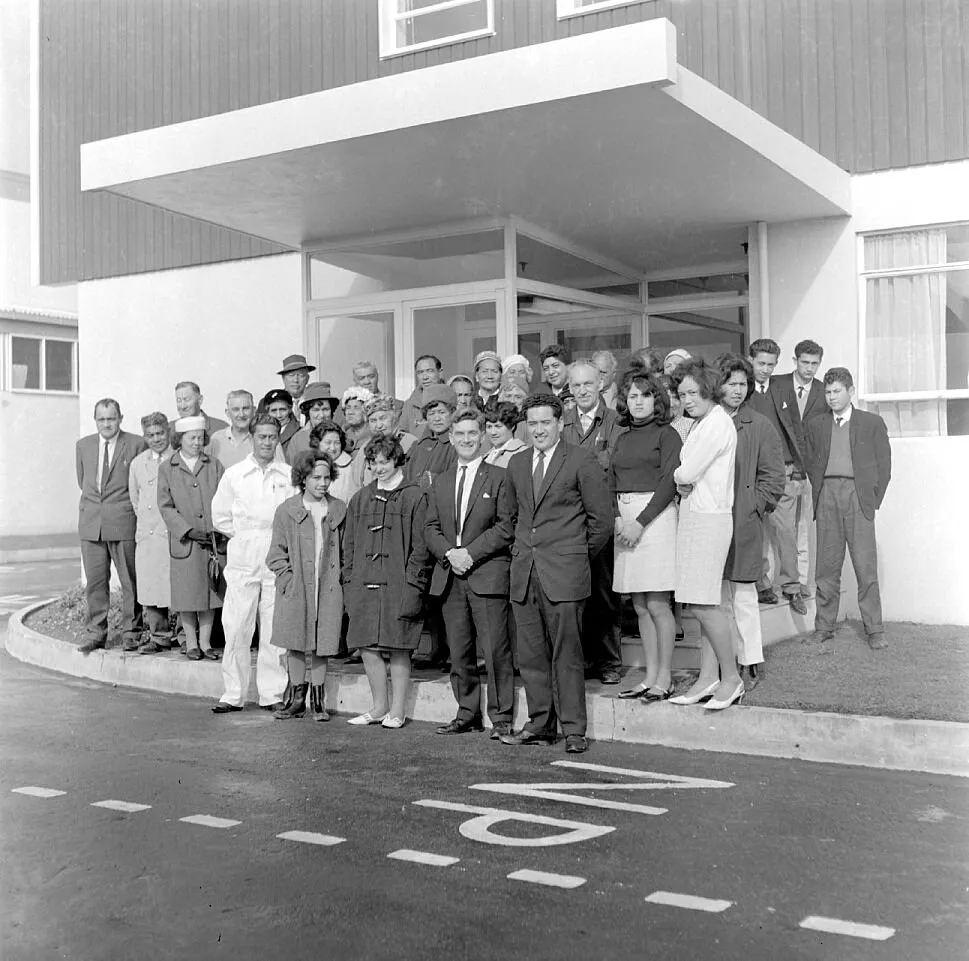 Dunlop; visiting Māori group at administration block entrance.