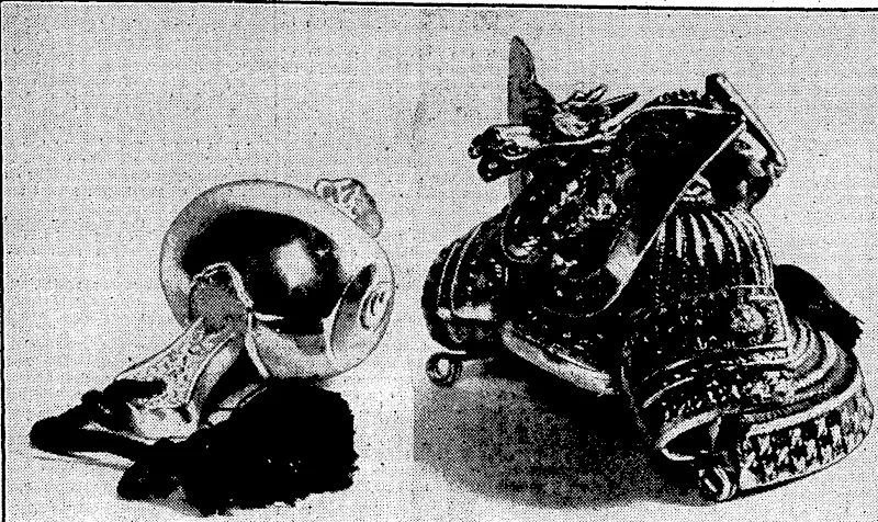 bveulnii fusf ruulo. GIFTS'FROM A JAPANESE PRINCE.^/F/iere the Japanese training squadron was in Wellington the above gijts, a silver mallet and a replica of an ancient Japanese'helmet, were presented to Major-General B. ■ ■ ■ * \ . . . i . ! S. Merlin by Hirohide Fushimi.^ .. > , .. ■ (Evening Post, 29 May 1935)