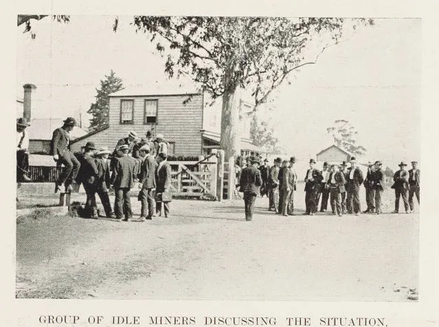 Group of idle miners discussing the situation
