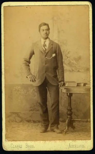 Image: [Unidentified man in suit]