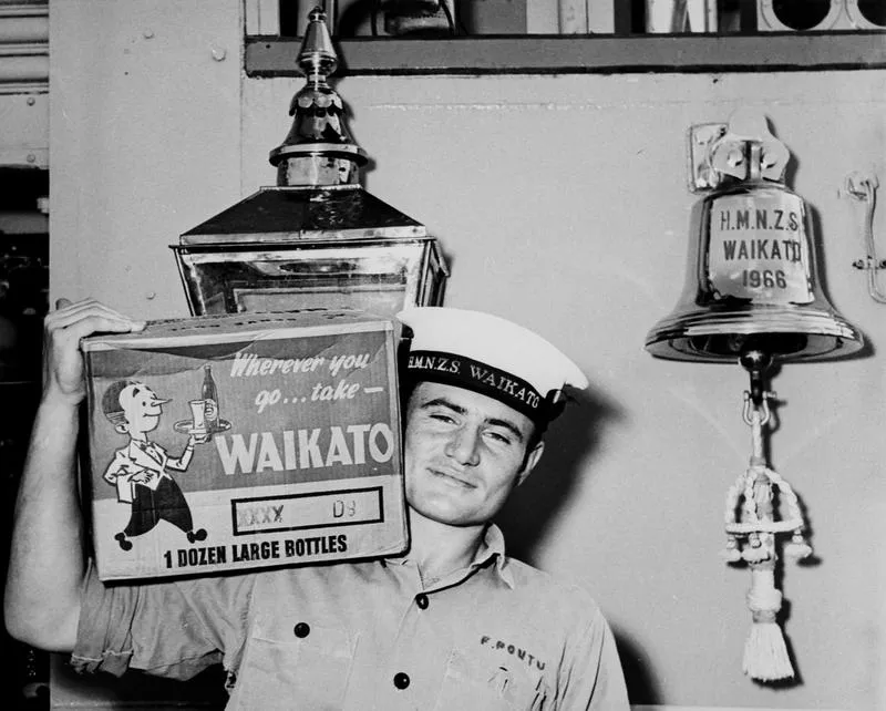 O/S F Poutu carrying beer onto HMNZS Waikato 1966