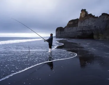 Image: Tongaporutu Coastline - fisherman at Twin Creeks, 9 December 2003