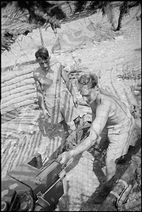 N Hunt and E J Betts maintain NZ Divisional Artillery gun in Cassino area, Italy, World War II - Photograph taken by George Kaye