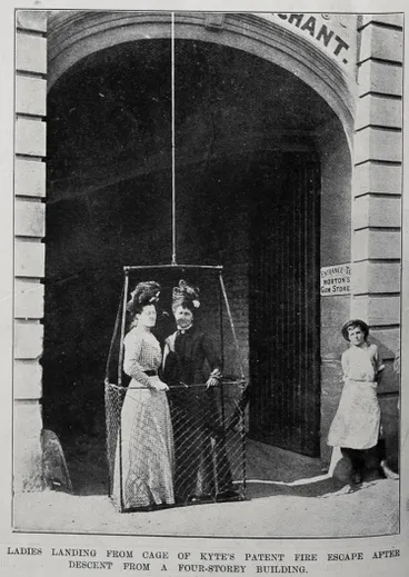 Image: Ladies landing from a cage of Kyte's patent fire escape after descent from a four storeyed building