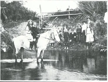Image: On their way to school: children fording the river, Waikawa Valley
