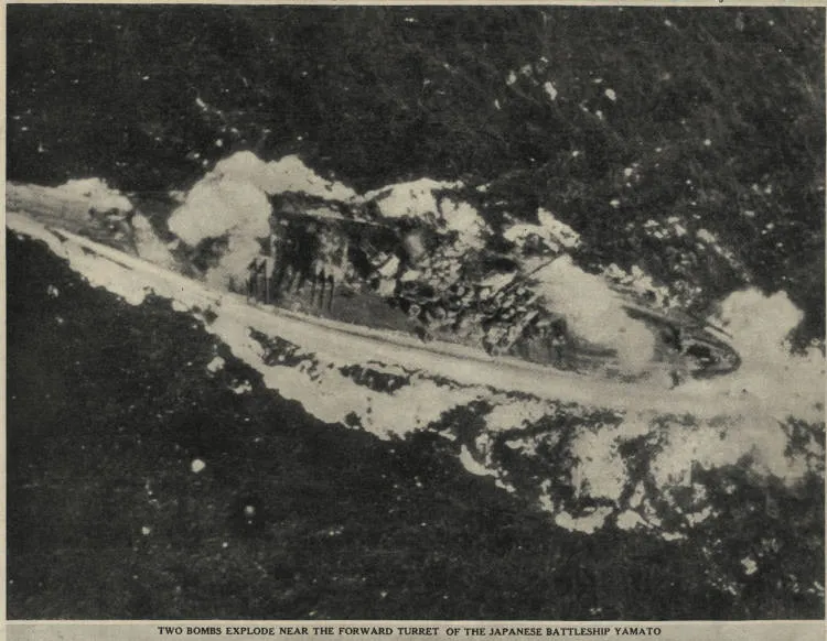 Two bombs explode near the forward turret of the Japanese battleship, Yamato