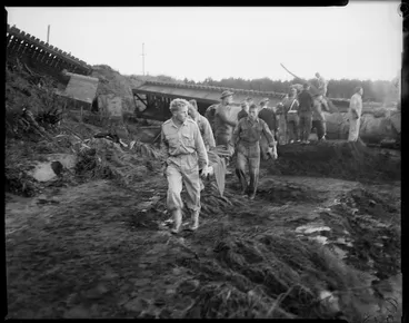Image: Rescue workers carry out a stretcher at the scene of the railway disaster at Tangiwai