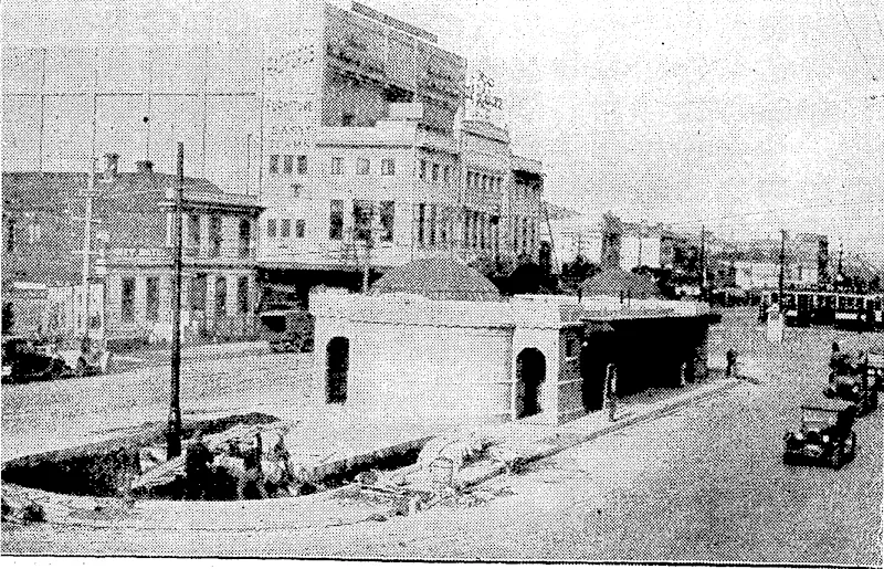 Evening Post" Photo. The new rest rooms, for both sexes, in Clyde quay square, were made available this morning. The building, in concrete, with copper domes at either end, is of pleasing design, and is fitted in accord with modern standards for public conveniences and rest rooms. A garden plot is to be laid out at the northern end of.the building, where work is now proceeding, as seen in the photograph. Sheltered seating is provided on either side of the building, and four telephone boxes are to be installed. (Evening Post, 12 July 1929)