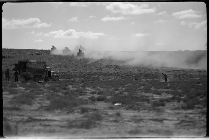 Armed columns stir up dust advancing with the NZ Division into Libya, World War II