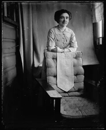 Image: Woman leaning on chair