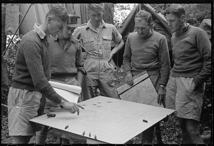 World War II soldiers from a New Zealand Division flash spotting troop surveying a concentration board, Cassino area, Italy - Photograph taken by George Kaye