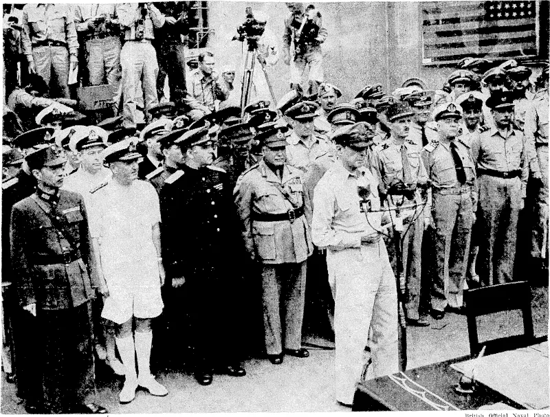 Scene aboard the U.S.S. Missouri in To/do Bay as General Douglas MacArlhur, ivho is facing ilia Japanese envoys, outlined the terms oj the surrender. Standing behind General MacArlhur are the signatories to the treaty on behalf of the Allies. From left/ General Hsu Yung-Chang (China), Admiral Sir Bruce Fraser (Great Britain), Lieut.-General K-. Derevyanko (Russia), General T. A. Blarney (Australia), Colonel L. Moore Cosgrave (Canada), partly obscured, General Leclerc (France), Admiral C. E. Helfrich (Netherlands), Air Vice-Marshal L. M. Isitt (New Zealand). General Mac Arthur and Admiral Nimitz signed on behalf of the United Slates. The American flag seen on the right -was floivn in Japan by Admiral Perry when he forced the Japanese lo open certain ports to foreign trade in 1853. (Evening Post, 10 September 1945)