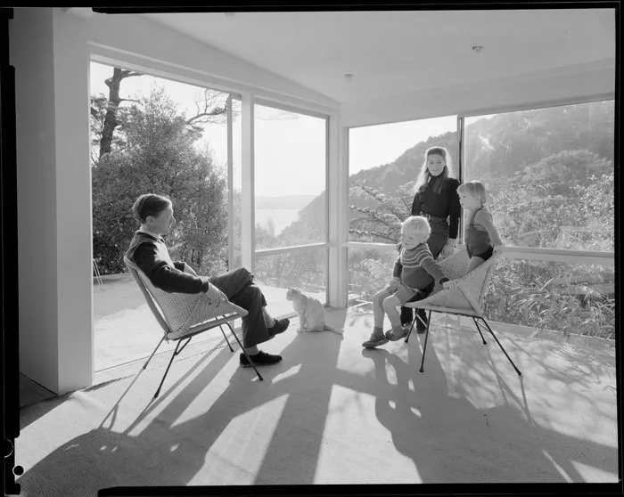 Family group in living room of unidentified house