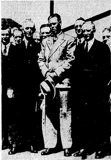 Image: Kvenlng Post" Photo, The American, alhlele Alfred L. Filch, who has-been engaged as coach by the Wellington Amateur A thletic Centre,, arrived at Welling' ton this morning by the Limited, and was met by athletes and v officials. He as shown with Mr, R. B. Reynolds (left) and Mr. At C.Kitto-(right),'president-of the'eentre. ■ • (Evening Post, 27 November 1937)