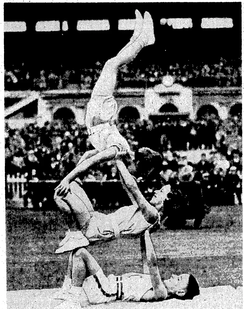 Jivening P.ost" Photo. The two Japanese athletes K. To garni (left) and K. Murakoso are: seen in the-top picture, waiting to compete at the Basin Reserve on : Saturday. With them,-from the left, are B. Ciapham, (Hawera), 8.. Mclntosh, and P. G. Carr. Below, a gymnastic display :by juveniles, which attracted a lot of attention during an' interval: in the sports •. . ■" . V programme. . ' . '' ■:ii. (Evening Post, 22 March 1937)