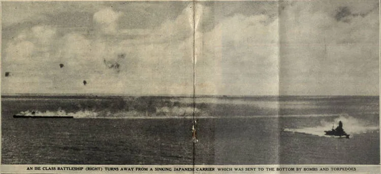 An Ise class battleship (right) turns away from a sinking Japanese carrier which was sent to the bottom by bombs and torpedoes