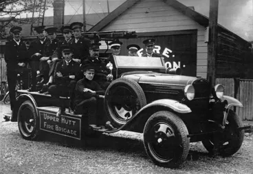 Image: Fire fighters pose on Upper Hutt Fire Brigade truck outside fire station.