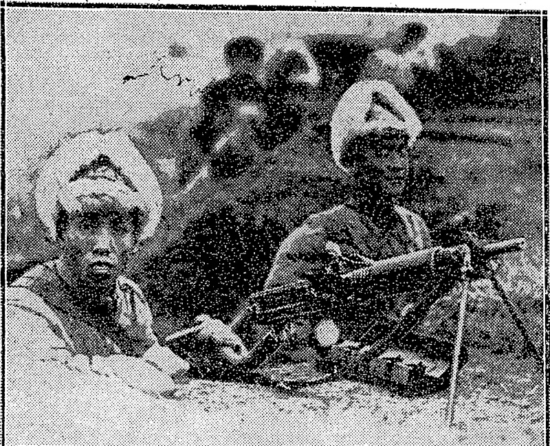 Sport and General" Photo. CHINESE MACHINE GUNNERS IN THE TRENCHES.-P/btograph taken on the war-front at Shanghai during the fighting between China and Japan at Shanghai. Note the peculiar head-dress,- made to withstand the.severest weather conditions. (Evening Post, 11 March 1932)