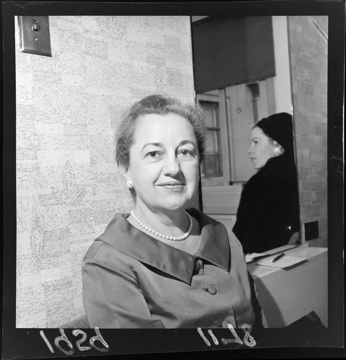 Mrs Kathryn Felt (nee Cowley), wife of Southeast Asia Treaty Organization (SEATO) military advisor Admiral Harry Donald Felt, with the reflection of another unidentifed woman in a mirror