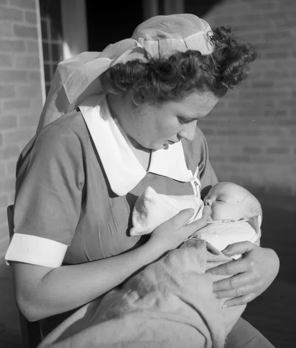 Karitane nurse bottle feeding a baby