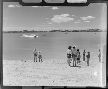 Image: People watching a water skier at Maraetai beach, Auckland