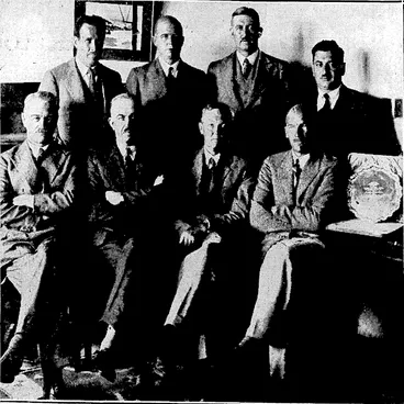 Image: v..'-.'.■ ;, "Evening Post". Photo. , DEPARTING AIR; COMMANDER FAREWELLED:—LocaI airmen who assembled yesterday to'present tWing-Commander Grant-Dalton with a piece of silver and To farewell him on his departure for England. Front row (from left), Squadron-Leader T: M.Wilkes, Director of Air Services, Mr. A..W* Nisbet, secretary of the Wellington Aero Club', Wing-Commander.. Grant-Daltoh, Squadron-Leader G. L. ■', ■ Sledman. Back row, MessrslF. Petre,GJD.M: Goodwin, GJ, Wallace, and C^Weinstein. "■ (Evening Post, 09 January 1932)