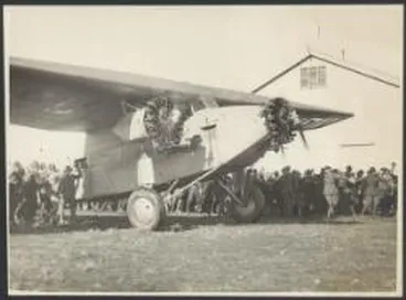 Image: Police holding back crowd as the Southern Cross, Fokker monoplane F.VII/3m, VH-USU arrives next to the hangar at Sockburn Aerodrome, Christchurch, New Zealand, 11 September 1928 / W. Raine Hall