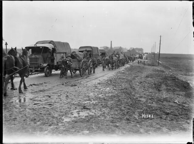 New Zealand military transport moving along a road in Le Quesnoy, France