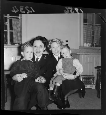 Image: Two female constables (P Mathieson and G Fullwood) with two children