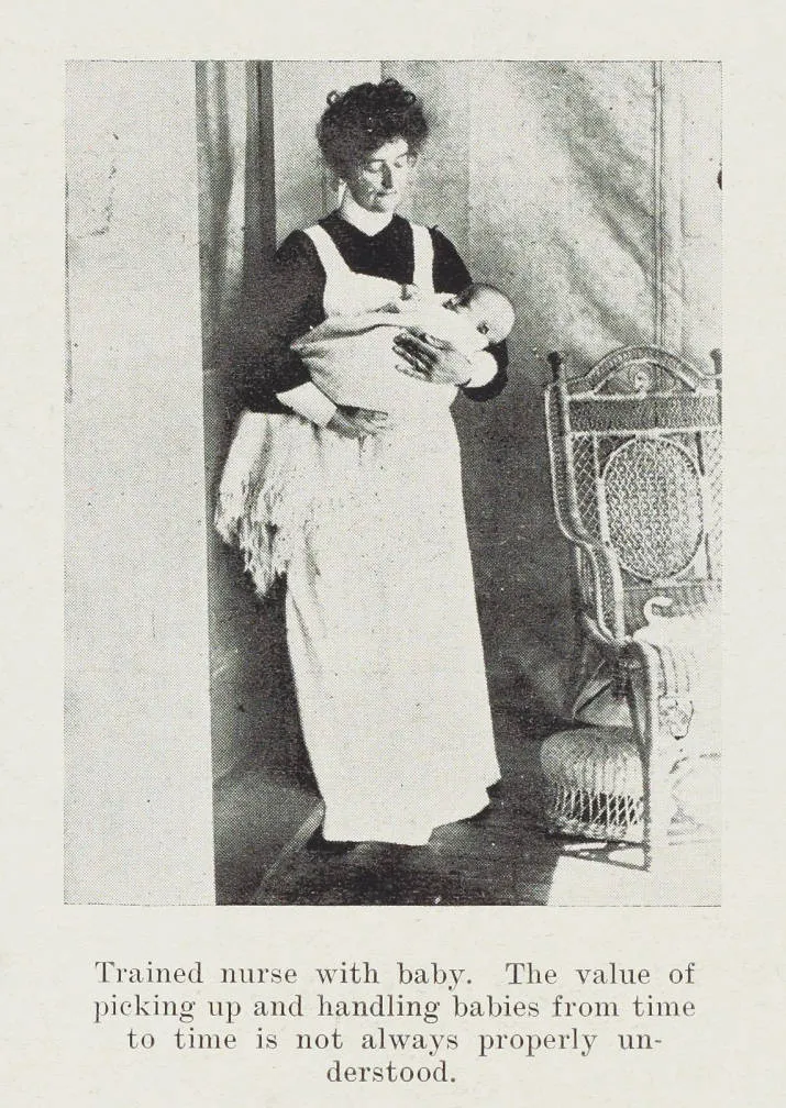 Trained nurse with baby. The value of picking up and handling babies from time to time is not always properly understood