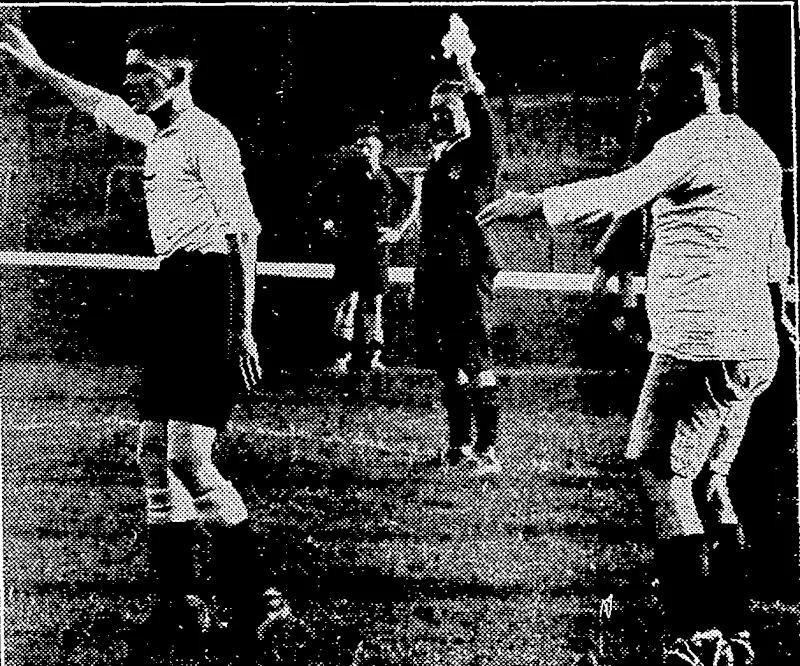 Sport and General" Photo. FOOTBALL FOR THE DEAF AND DUMB.—The referee .stops play by holding up his handkerchief, an incident during tfie Association football final between Britain and Belgium at the fourlfclnternational Games for the Deaf and Dumb. The match was,played at the Arsenal Football Ground, Highbury, London.- at the middle of August. Britain loon by 4 gdals:io2.-'';^/. (Evening Post, 21 September 1935)
