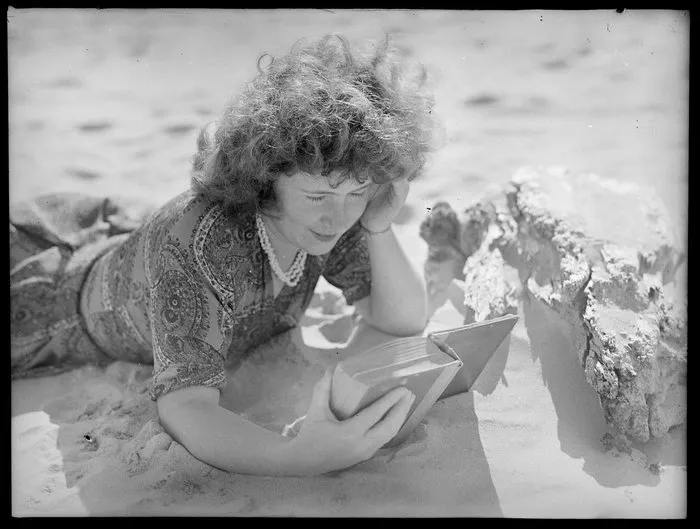 Unidentified woman reading on the beach, Norfolk Island