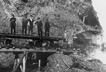 Image: Locomotive on coastal tramway by cliffs, north of Whatipu.