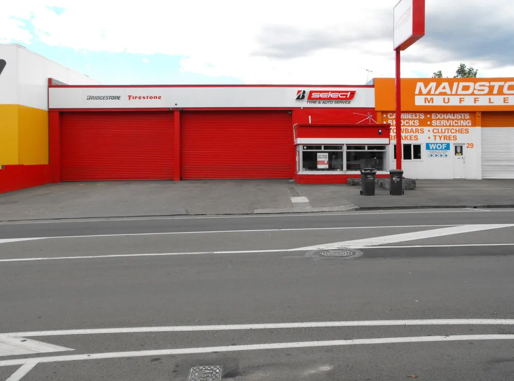 Queen Street, north side; No. 29; Bridgestone Tyre Centre/ Firestone
