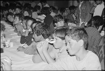 Image: Young Te Teko children waiting for their dinner at Hahura Marae, Onepu - Photograph taken by John Nicholson
