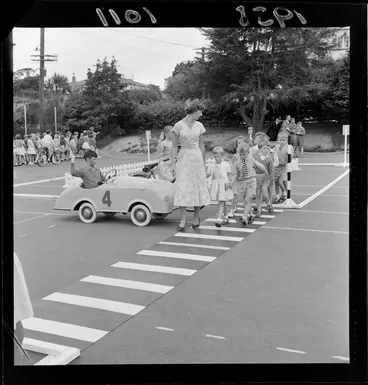 Image: Traffic training, Karori School, Wellington, children learning to stop at a pedestrian crossing to allow people to cross the road safely