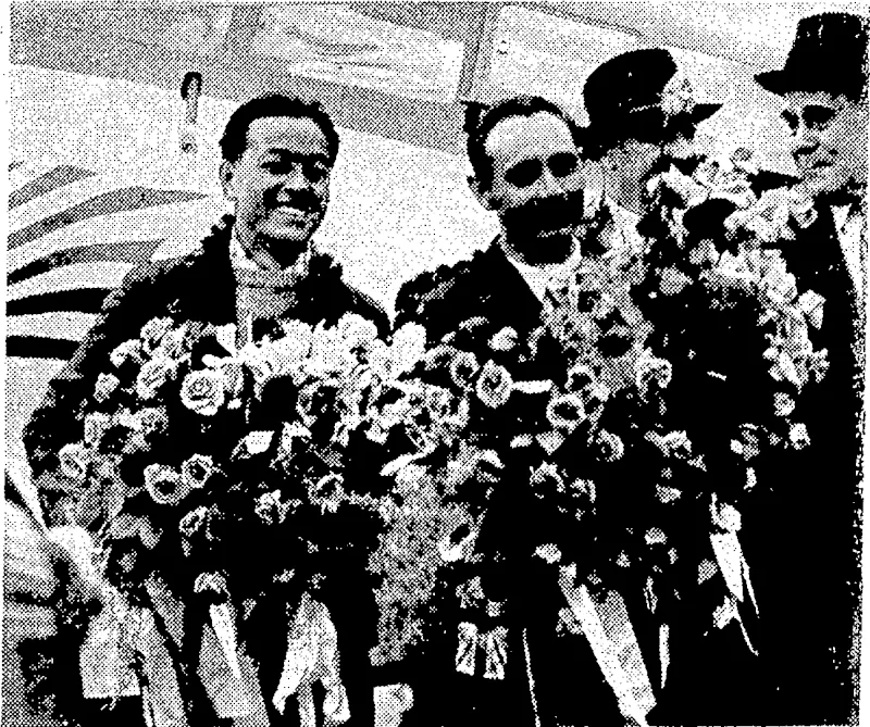 Sport and General" Thoto. The Japanese airman, linumba, and his wireless operator, Tsukagoshi, photographed at Croydon Aerodrome on April 9 after making aviation history; They flew from Tokio to Croydon, -via Rome ■ and Paris, in 94hr 14min. (Evening Post, 28 April 1937)