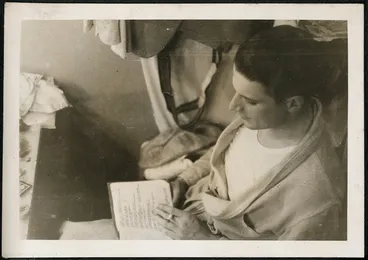 Image: Photograph of a man reading