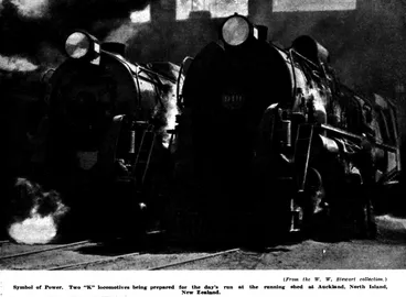Image: (From the W. W. Stewart collection.) — Symbol of Power. Two “K” locomotives being prepared for the day's run at the running shed at Auckland, North Island, New Zealand