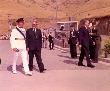 Image: Fletcher Holdings Ltd: 27Feb1964 The Governor-General, Sir Bernard Fergusson walks to the entrance of the Christchurch-Lyttelton Road Tunnel entrance with Mr Whitlock at the official opening