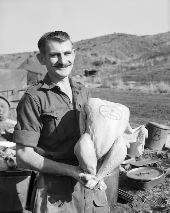 [Gunner Alan Kennedy of 162 Battery with a Christmas turkey, Korea]